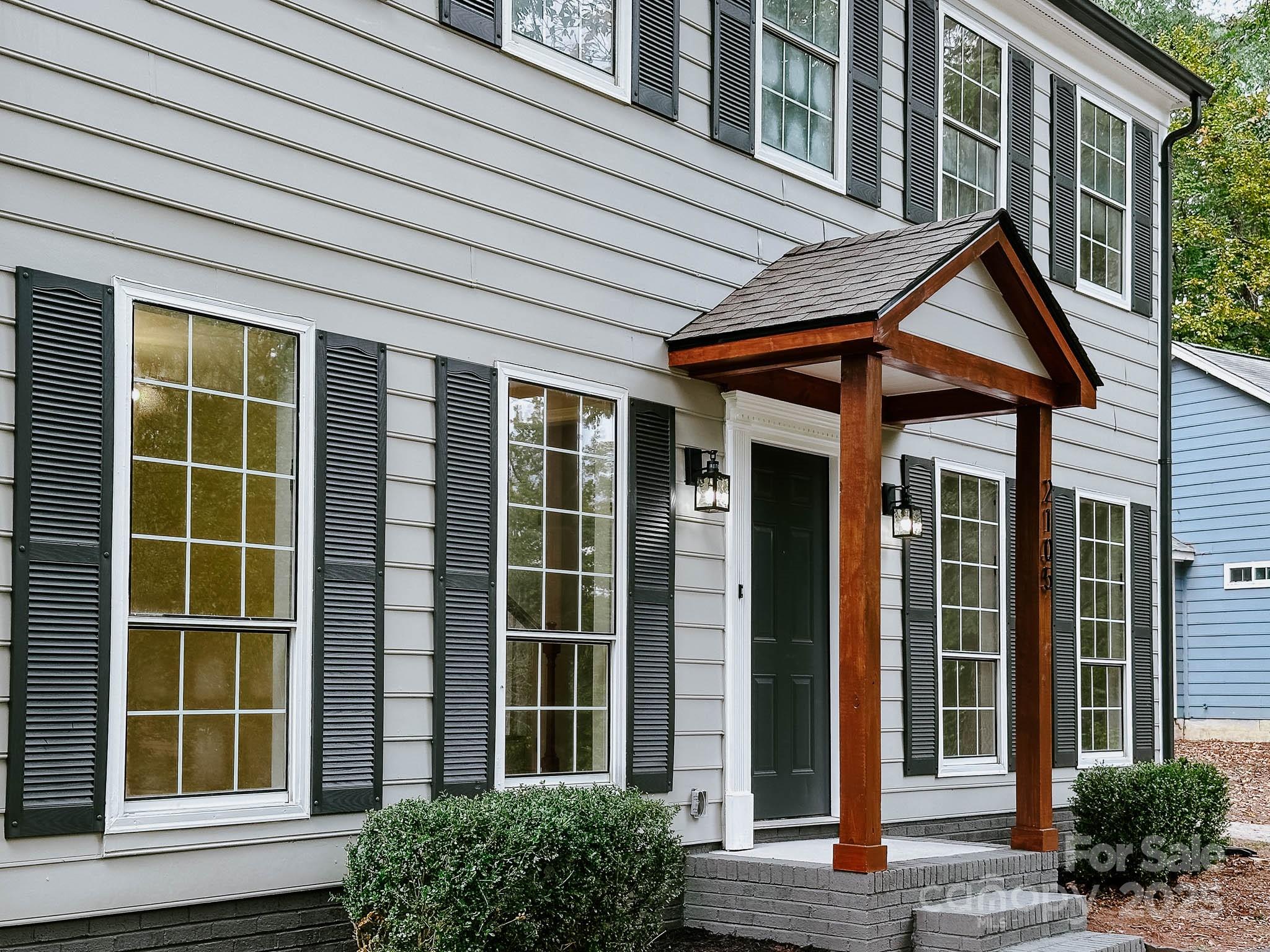 2105 Killarney Place Charlotte, NC 28262 - Photo 38 of 43 a view of brick house with large windows