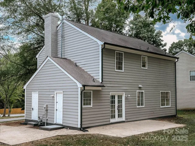 a view of a house with a yard and garage