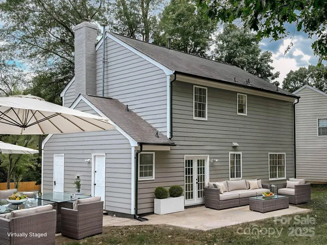 a backyard of a house with seating space