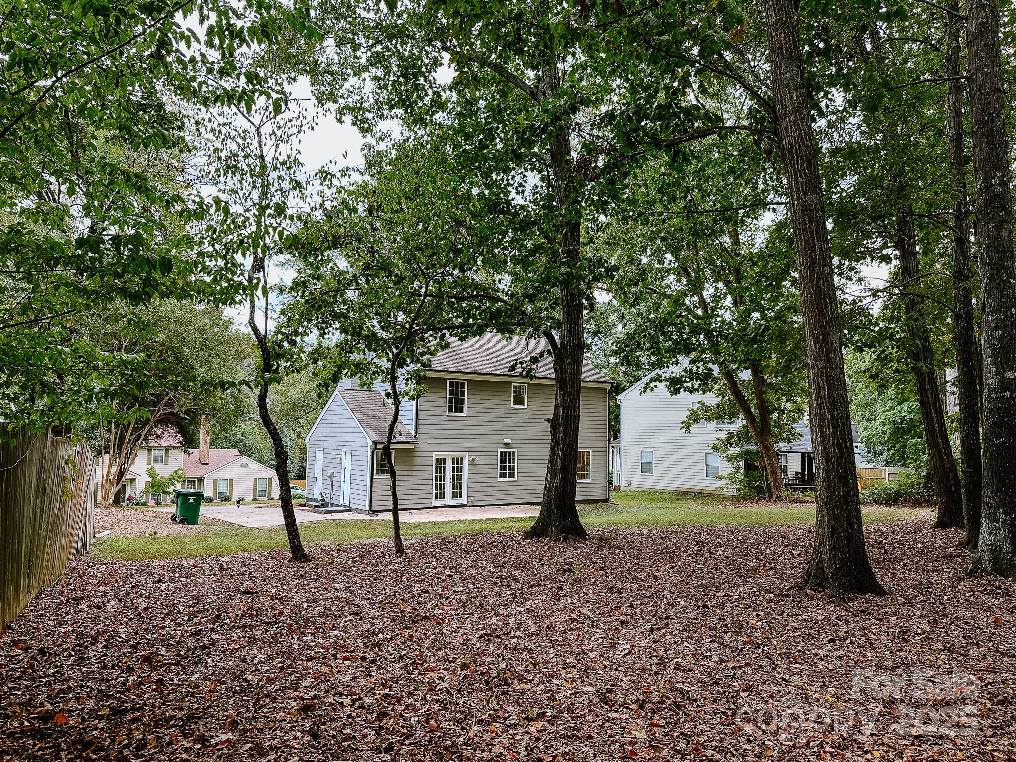 2105 Killarney Place Charlotte, NC 28262 - Photo 42 of 43 a view of a house with a tree in the background
