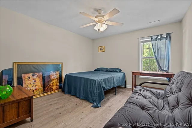 a bedroom with a bed and a couch