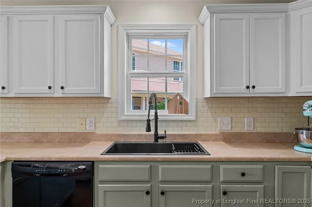 a kitchen with a sink and cabinets