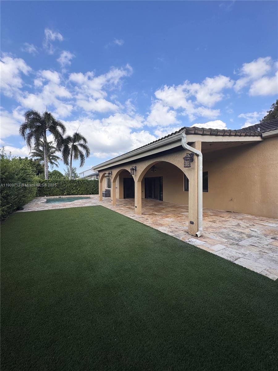 17910 Southwest 137th Court Miami, FL 33177 - Photo 23 of 25 a front view of a house with garden