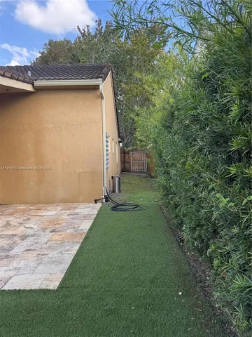 a backyard of a house with lots of green space
