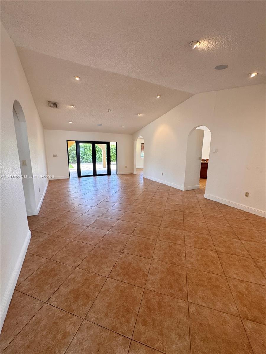 17910 Southwest 137th Court Miami, FL 33177 - Photo 10 of 25 a view of an empty room with a window