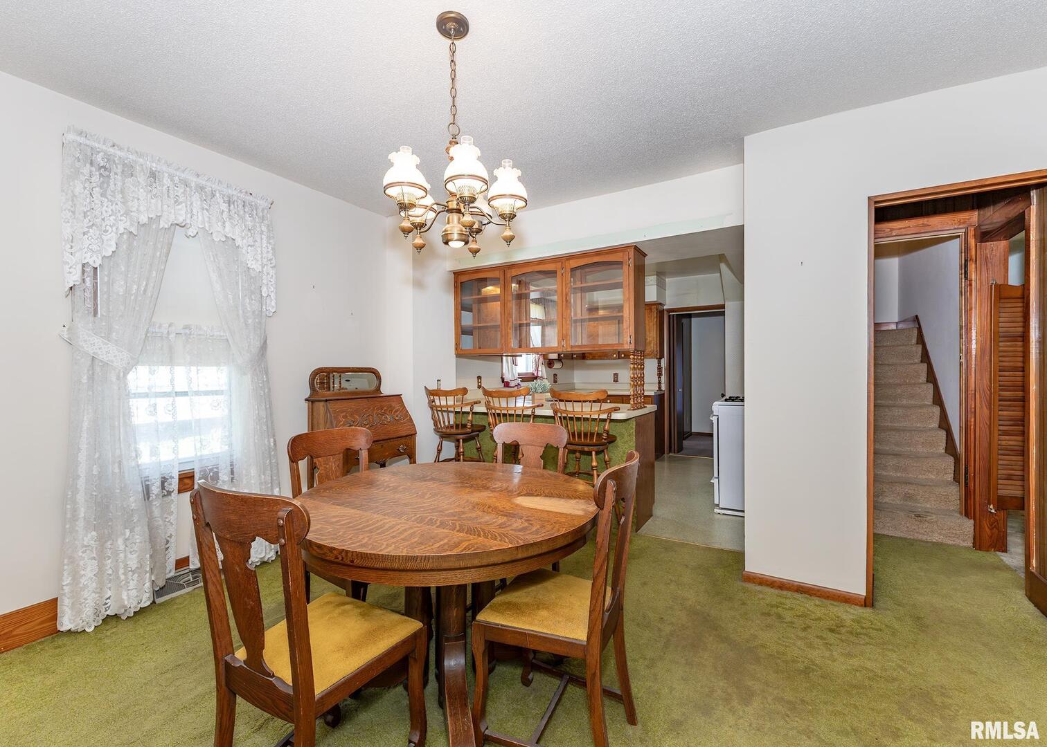 304 South 5th Avenue New Windsor, IL 61465 - Photo 22 of 29 a view of a dining room with furniture