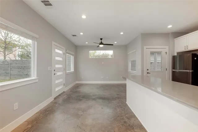 a view of an empty room with a window