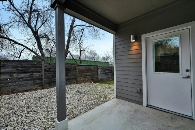 a view of wooden house and a yard