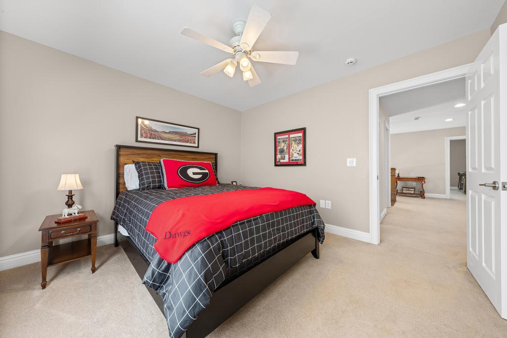 217 Maret Road Townville, SC 29689 - Photo 24 of 35 Well-lit sleeping quarters offering a restful ambiance and a view to the adjoining hallway.