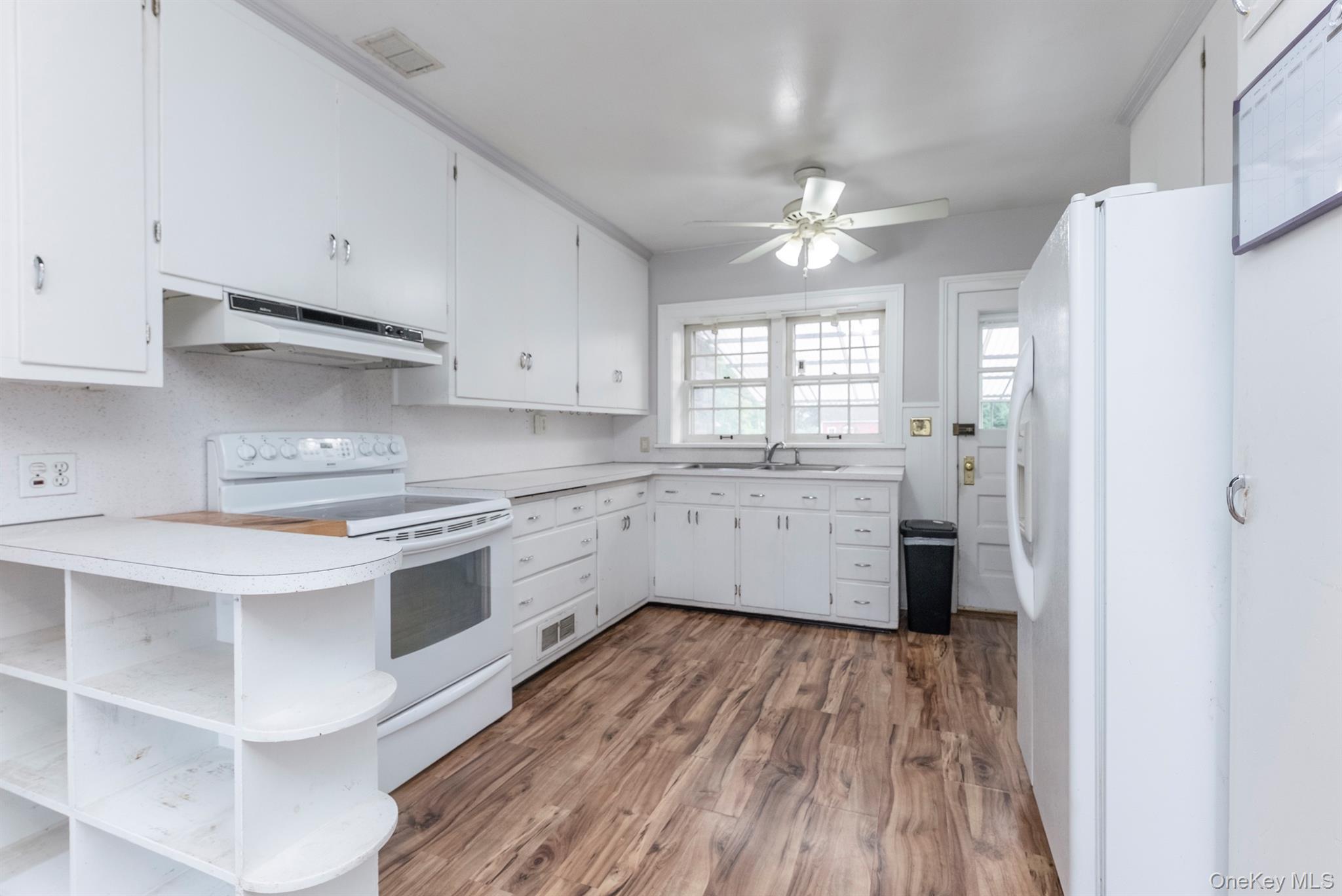 12 Zandhoek Road Hurley, NY 12443 - Photo 23 of 50 a kitchen with a sink cabinets stainless steel appliances and a window