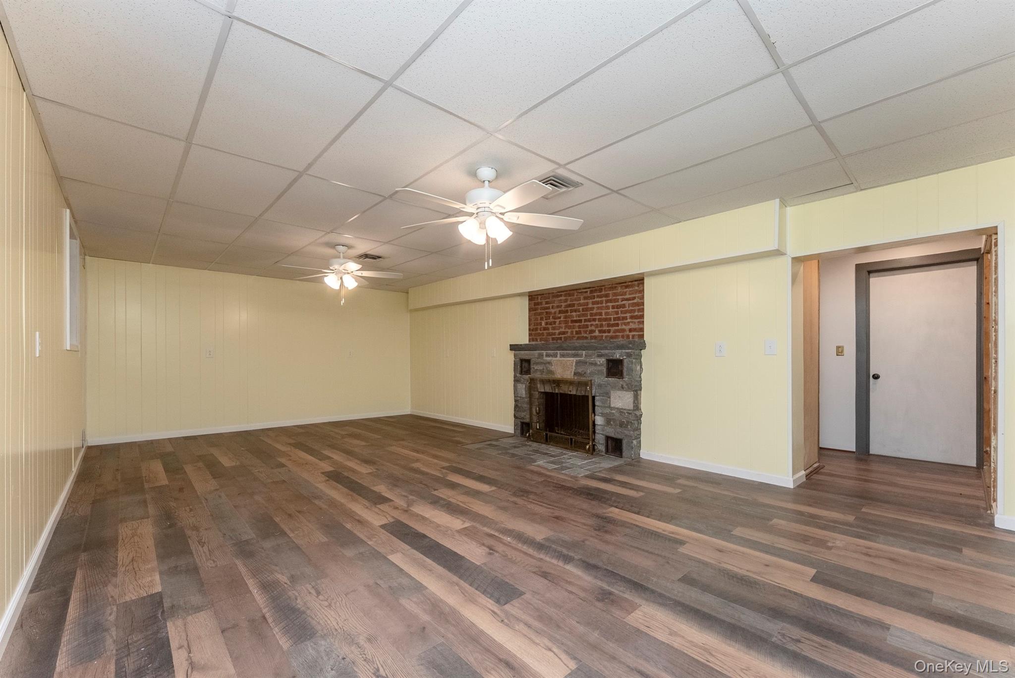 12 Zandhoek Road Hurley, NY 12443 - Photo 34 of 50 a view of empty room with fireplace and wooden floor