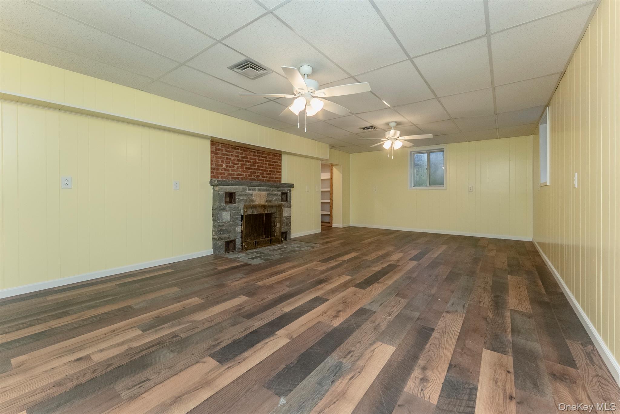 12 Zandhoek Road Hurley, NY 12443 - Photo 35 of 50 a view of empty room with a fireplace and wooden floor