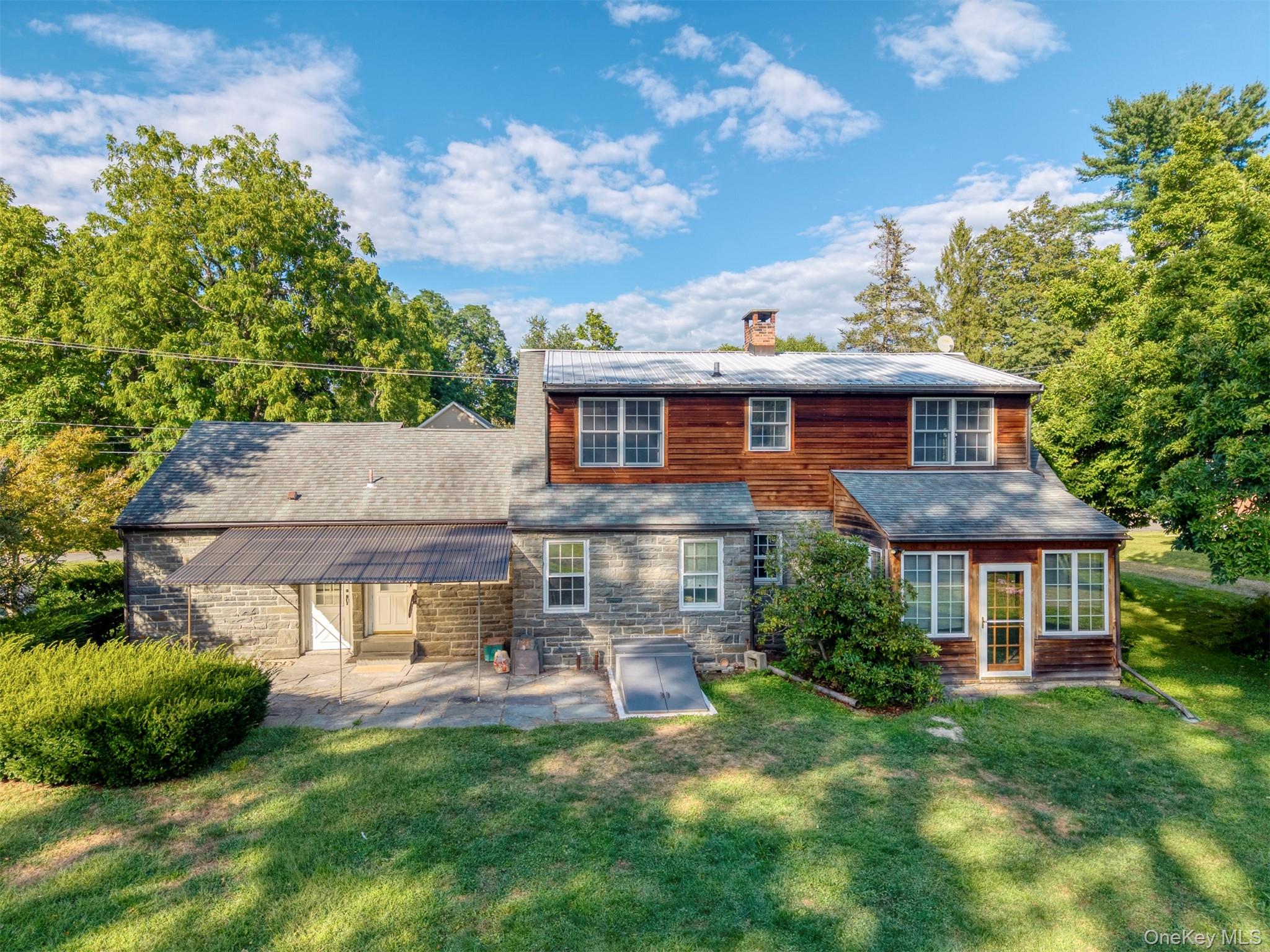 12 Zandhoek Road Hurley, NY 12443 - Photo 49 of 50 a front view of a house with a yard table and chairs