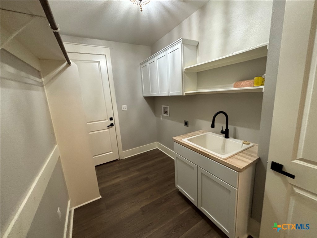 110 Hiram Cook Blanco, TX 78606 - Photo 23 of 46 a utility room with cabinets washer and dryer