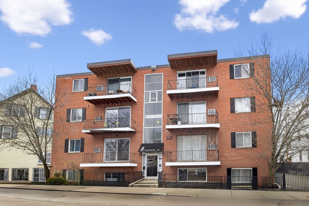 8 Kittredge Street, Unit 10 Boston, MA 02131 - Photo 13 of 16 a front view of residential houses