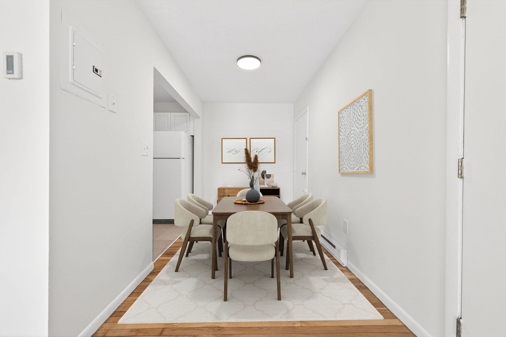 8 Kittredge Street, Unit 10 Boston, MA 02131 - Photo 4 of 16 a dining room with furniture and window