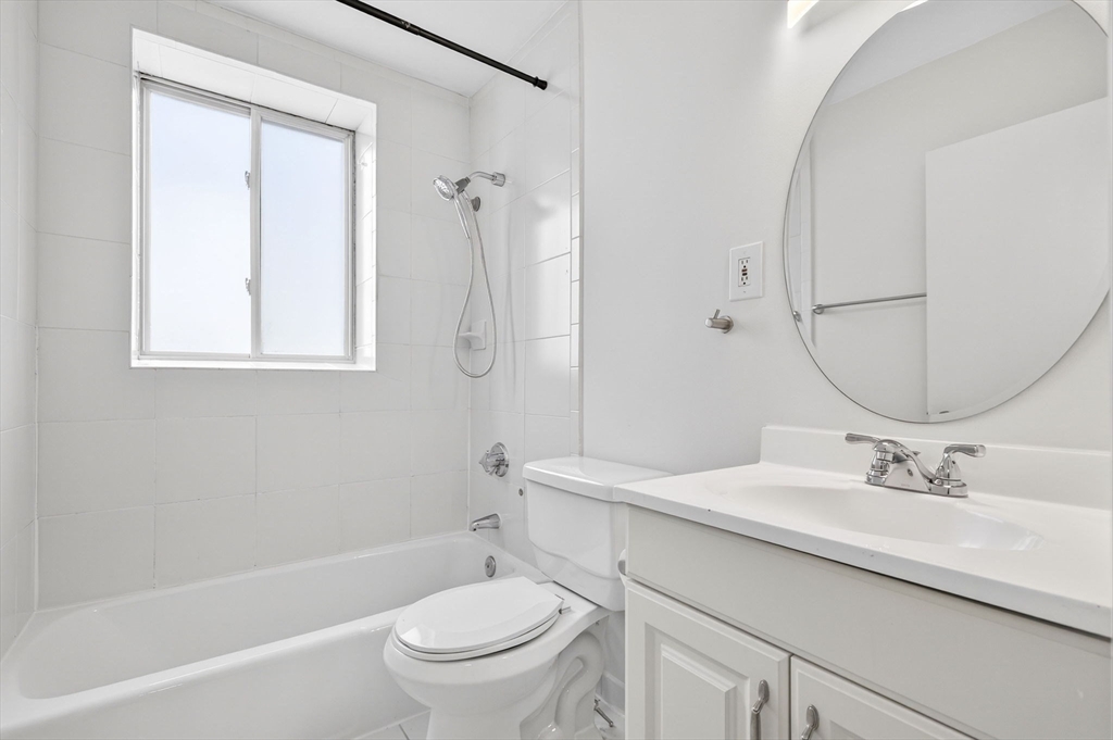 8 Kittredge Street, Unit 10 Boston, MA 02131 - Photo 7 of 16 a bathroom with a sink toilet and shower