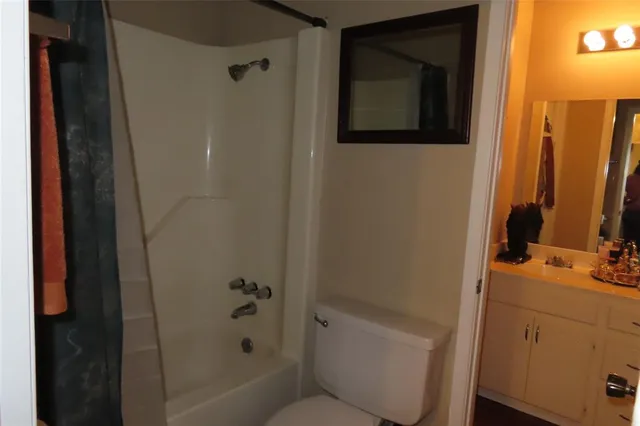 a bathroom with a bathtub and a sink