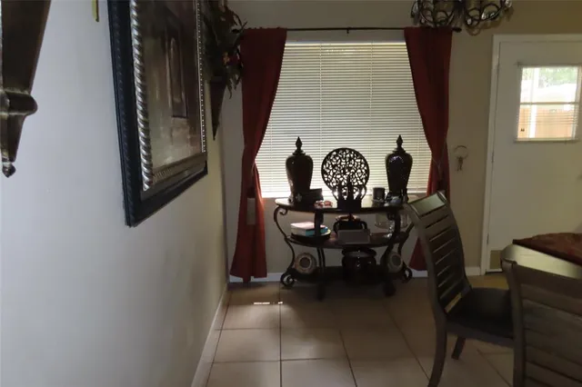 a view of a balcony with furniture and a window