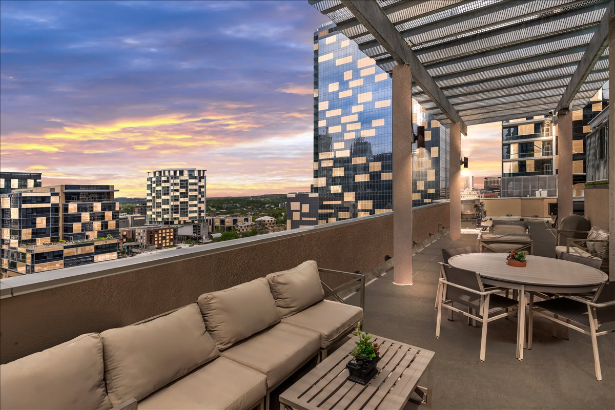311 West 5th Street, Unit 1005 Austin, TX 78701 - Photo 29 of 30 Whether enjoying morning coffee or evening sunsets, the balcony offers a tranquil outdoor space to relax while surrounded by the vibrant energy of the city below.