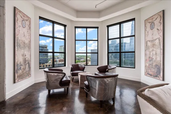 a living room with furniture and a large window