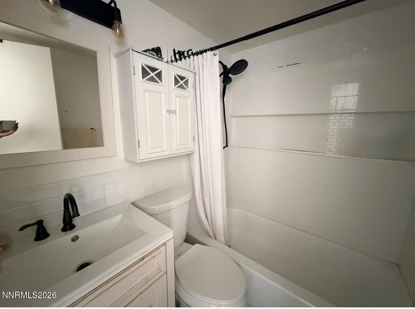 16770 Mt Rose Highway, Unit B Reno, NV 89511 - Photo 12 of 26 a bathroom with a sink and shower