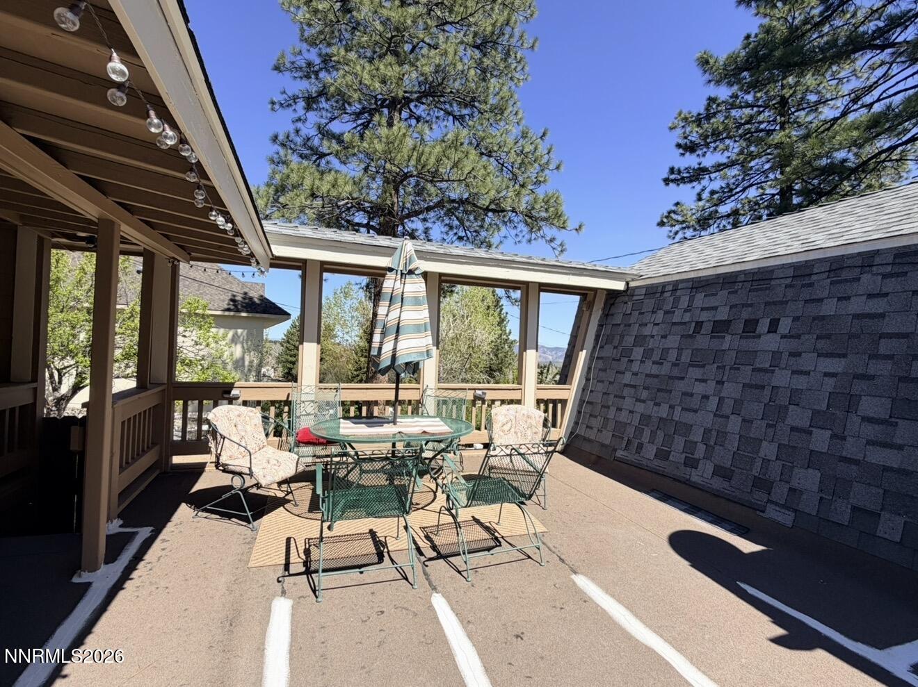 16770 Mt Rose Highway, Unit B Reno, NV 89511 - Photo 24 of 26 a living room with patio furniture and garden view