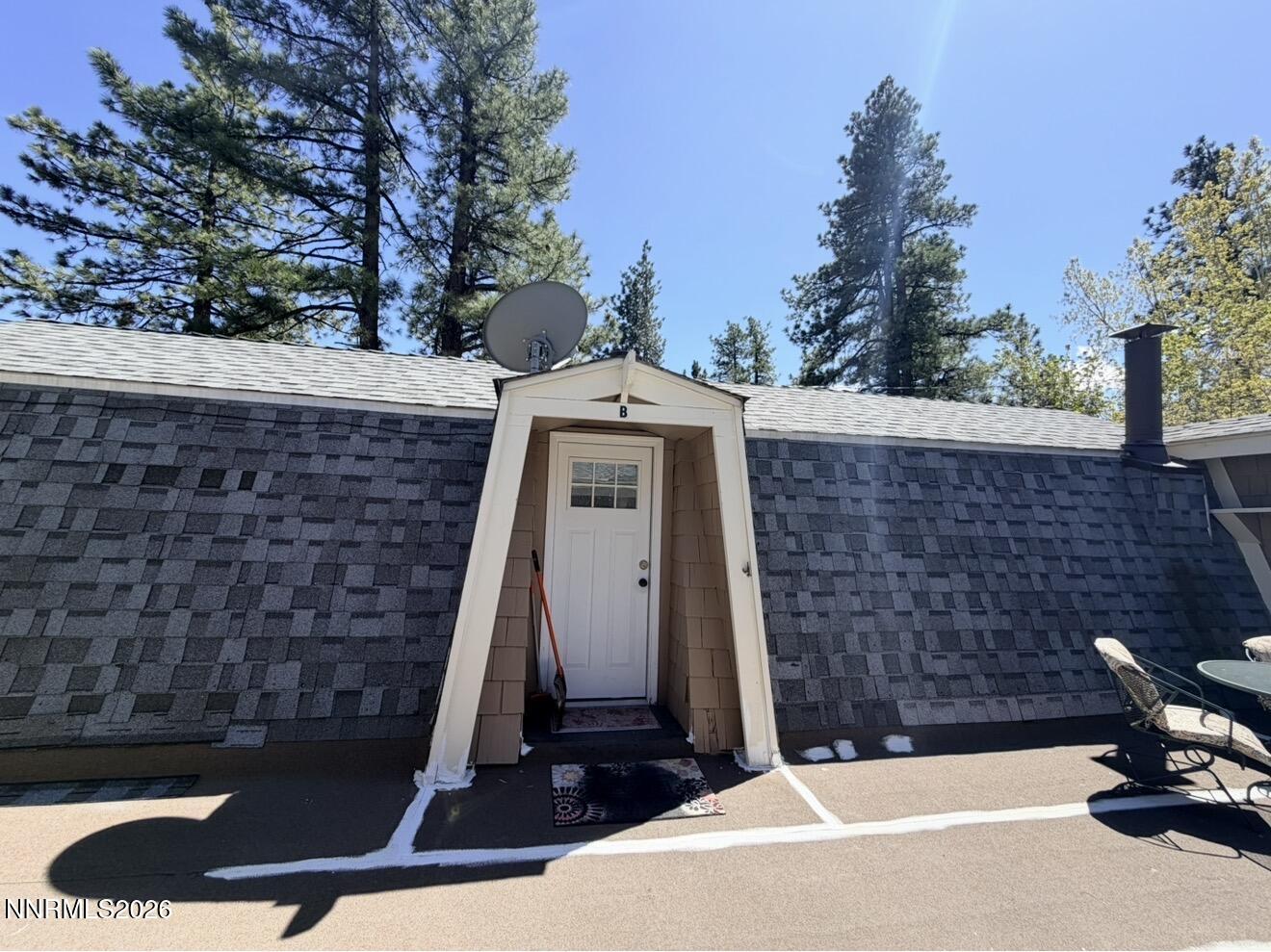 16770 Mt Rose Highway, Unit B Reno, NV 89511 - Photo 5 of 26 a front view of a house with a yard