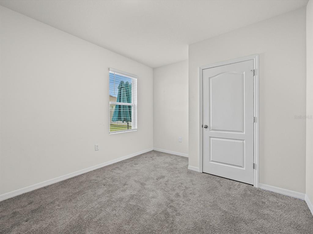 4223 San Rocco Way Winter Haven, FL 33884 - Photo 13 of 47 an empty room with windows
