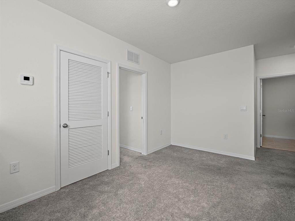 4223 San Rocco Way Winter Haven, FL 33884 - Photo 17 of 47 an empty room with closet area