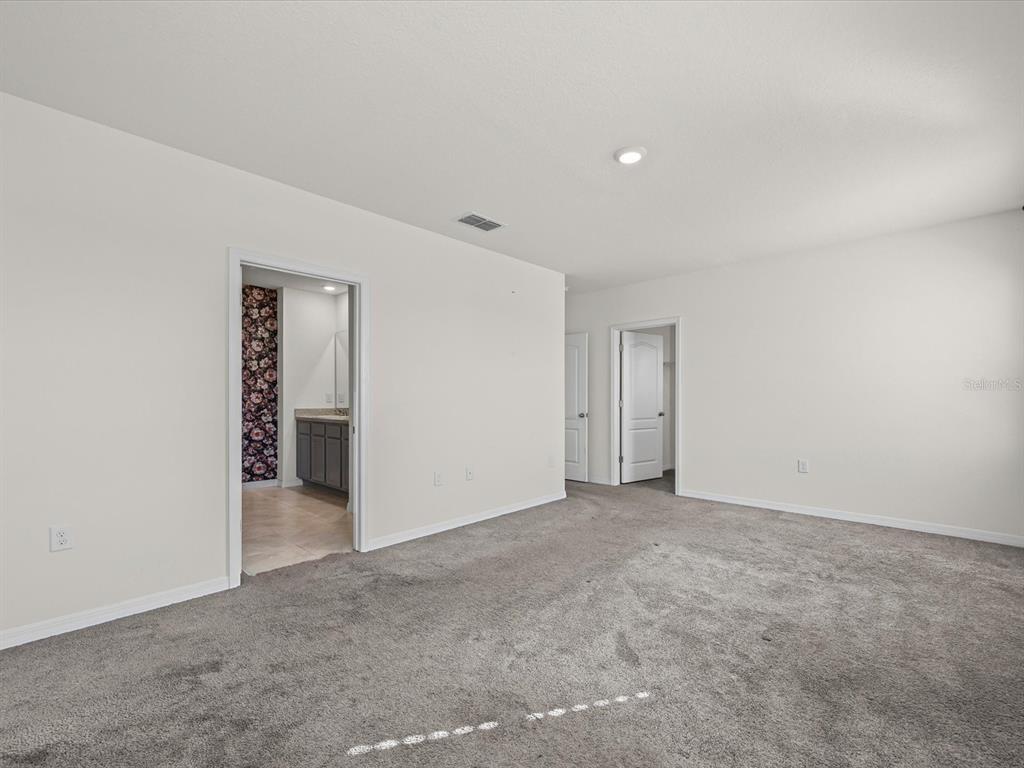 4223 San Rocco Way Winter Haven, FL 33884 - Photo 21 of 47 an empty room with closet
