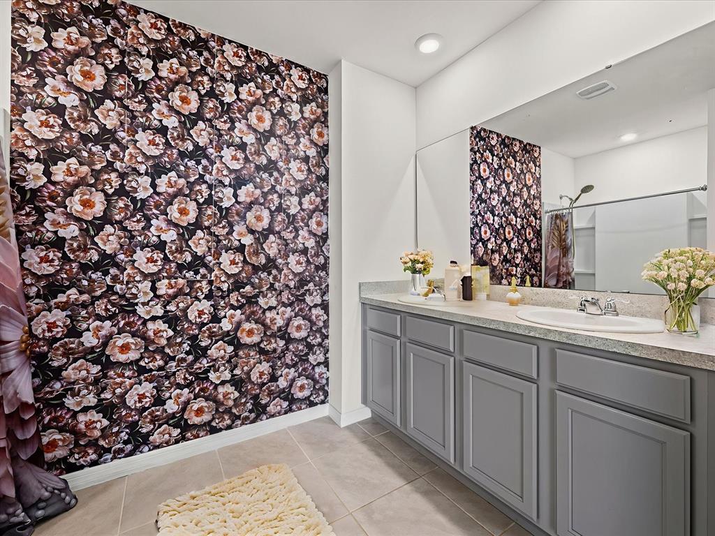 4223 San Rocco Way Winter Haven, FL 33884 - Photo 23 of 47 a bathroom with a sink and a mirror