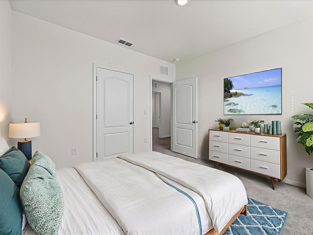 4223 San Rocco Way Winter Haven, FL 33884 - Photo 27 of 47 a bedroom with a bed and a dresser