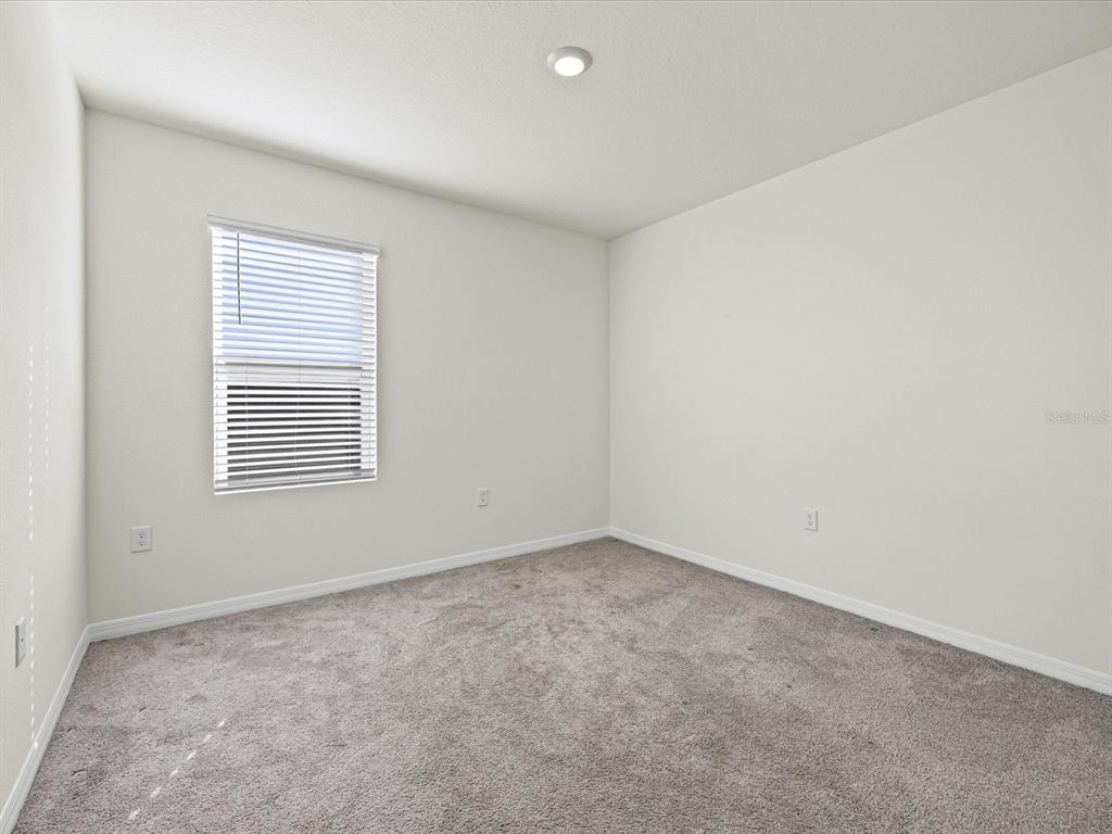 4223 San Rocco Way Winter Haven, FL 33884 - Photo 29 of 47 an empty room with a window