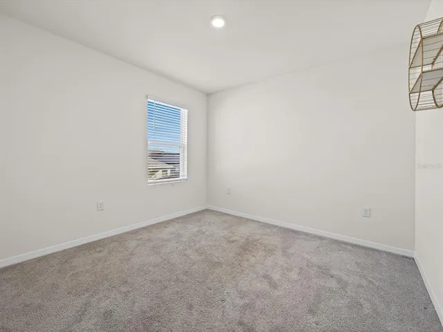 an empty room with a empty space and a window