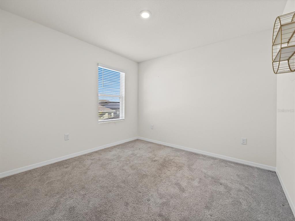 4223 San Rocco Way Winter Haven, FL 33884 - Photo 30 of 47 an empty room with a empty space and a window