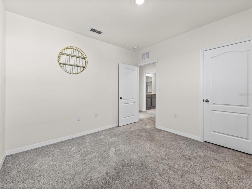 4223 San Rocco Way Winter Haven, FL 33884 - Photo 31 of 47 an empty room with windows