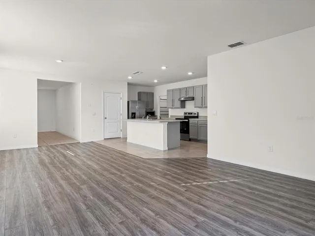 a view of kitchen with wooden floor