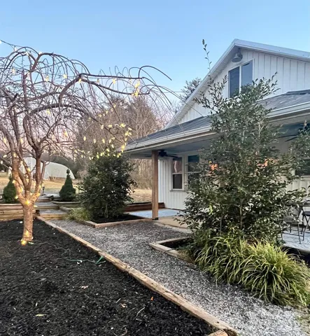 a front view of a house with garden