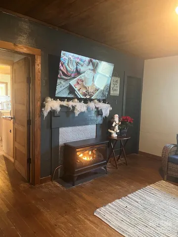 a kitchen with a stove a sink and a refrigerator