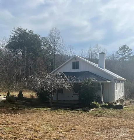 a view of livingroom with hardwood floor and bathroom