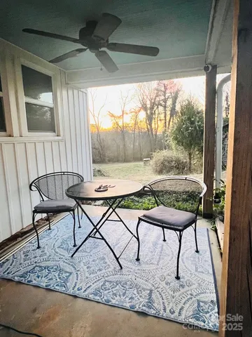 a view of a livingroom with furniture and a fireplace