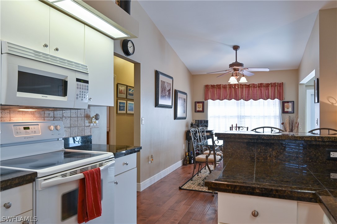 9092 Morris Road Fort Myers, FL 33967 - Photo 16 of 28 a kitchen with stainless steel appliances a stove a sink and a refrigerator