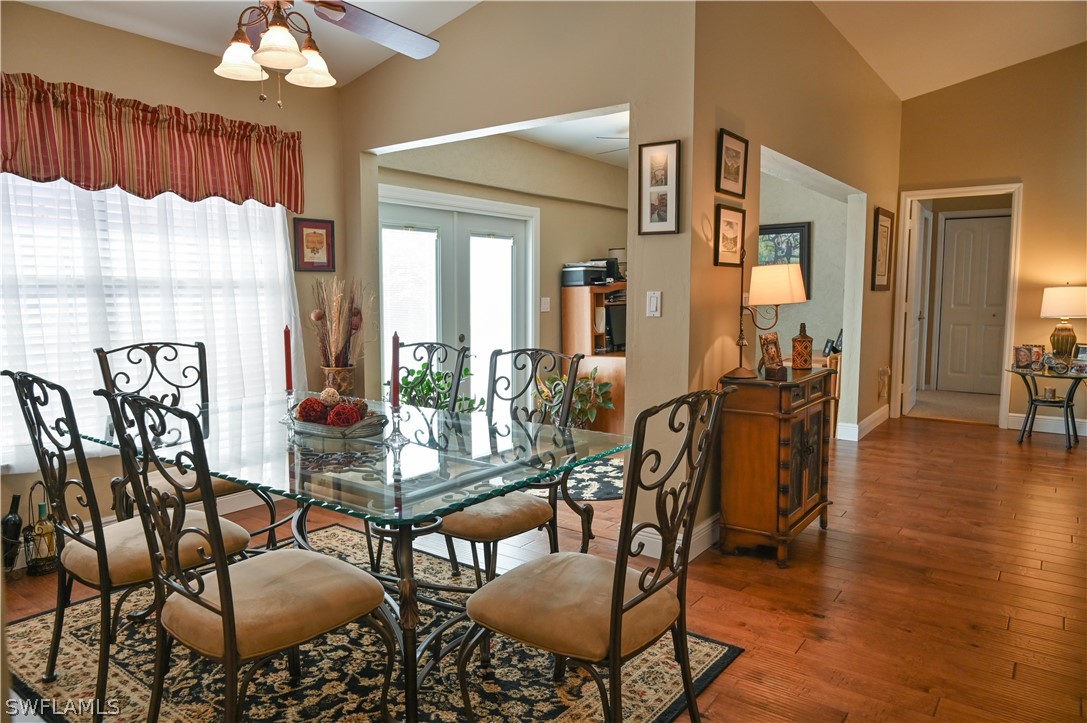 9092 Morris Road Fort Myers, FL 33967 - Photo 6 of 28 a living room with furniture a chandelier and a large mirror