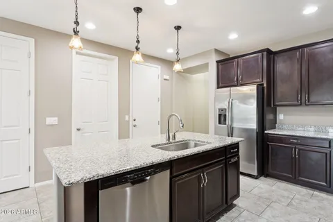 a view of a hallway with a white walls and a stairs