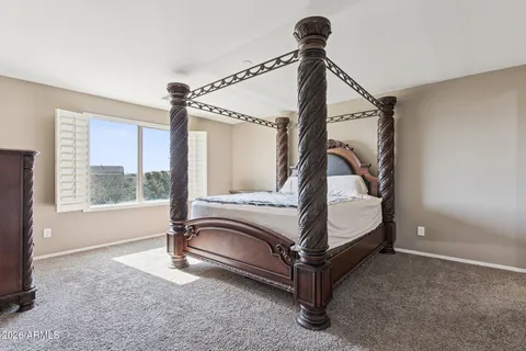 a bathroom with a bathtub sink and mirror