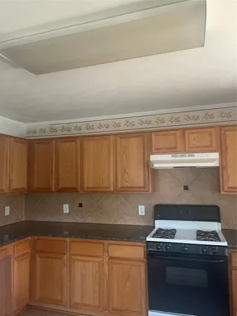 a view of cabinets with sink