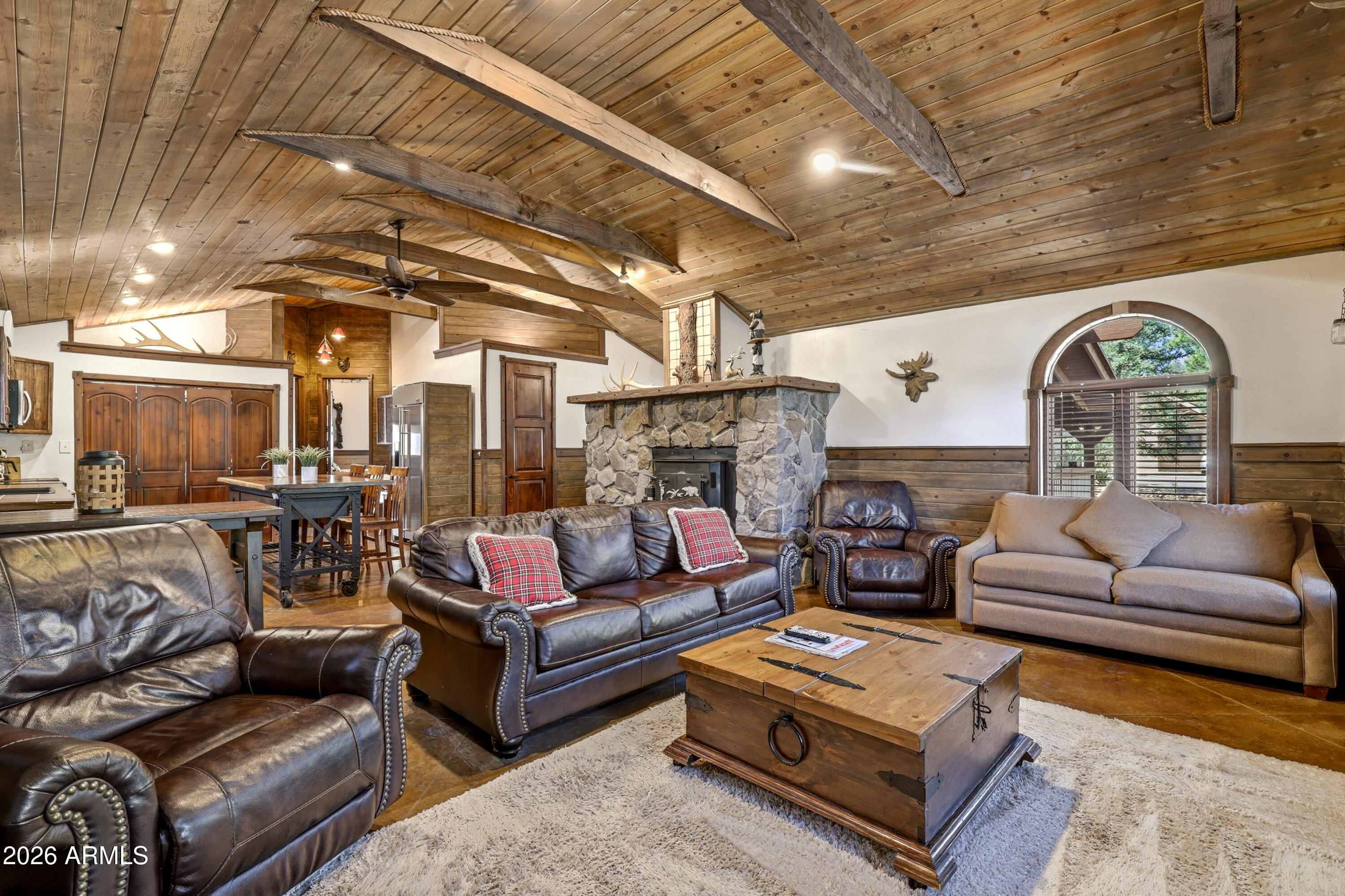 4971 Buck Springs Road Pinetop, AZ 85935 - Photo 7 of 32 a living room with furniture and a fireplace
