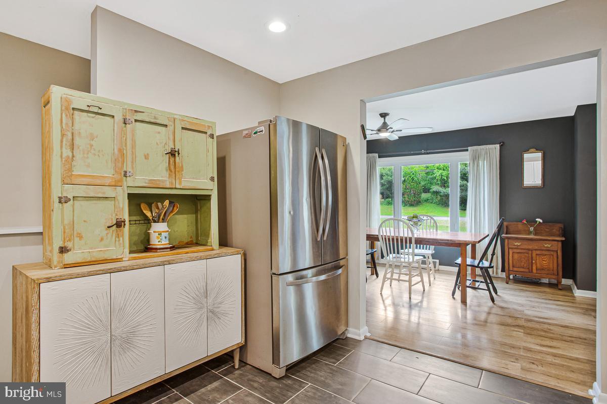 976 Shore Acres Road Arnold, MD 21012 - Photo 16 of 40 a kitchen with stainless steel appliances granite countertop a refrigerator and a stove top oven