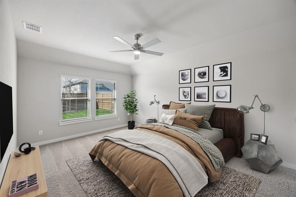 1456 Companero Street Haslet, TX 76052 - Photo 14 of 33 a bedroom with a bed and a window